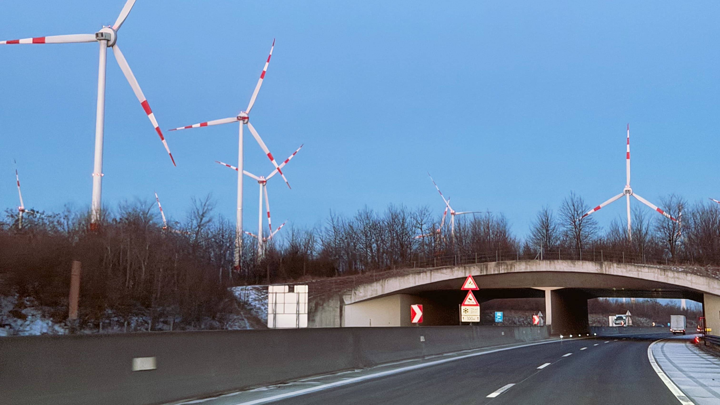 Wind turbines along a highway in Austria
